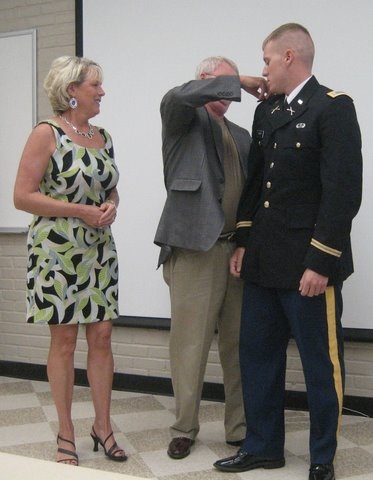 Rusty pins on Bretts (his son) 2nd Lt. bars during the U.S. Army graduation at Fort Benning, GA       2008