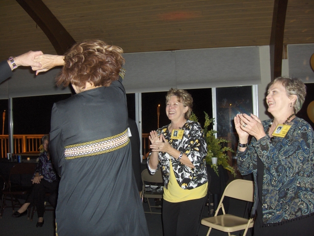 Carolyn House Fohl and Harriet McHughes Johnson watching Kathy McIver dancing at the Reunion Dinner